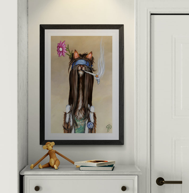 Framed artwork of a cat with a flower on a wall above a white cabinet.