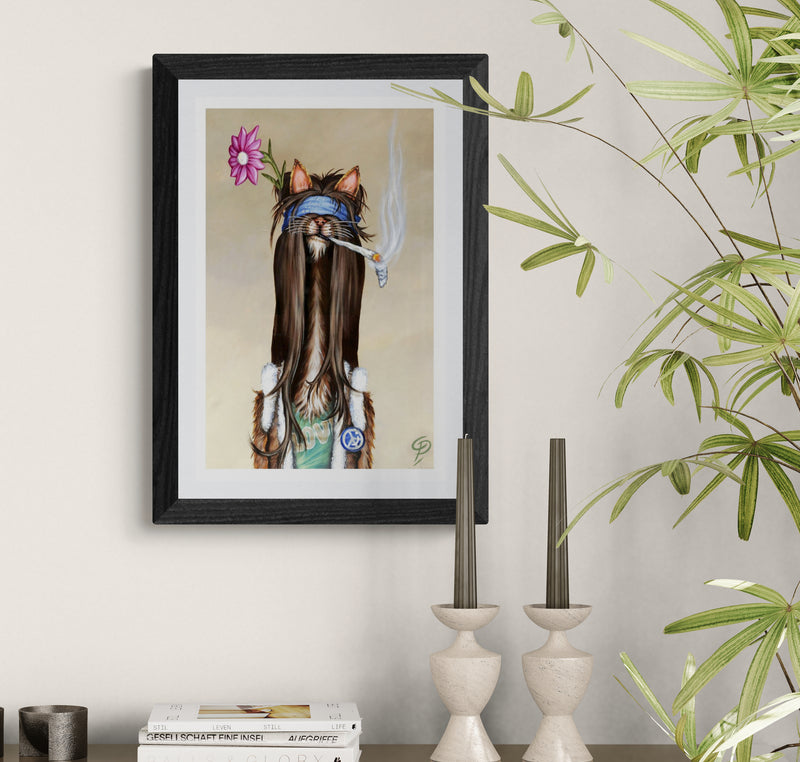 Framed artwork of a cat with long hair, flowers, and a blue bandana on a wall.