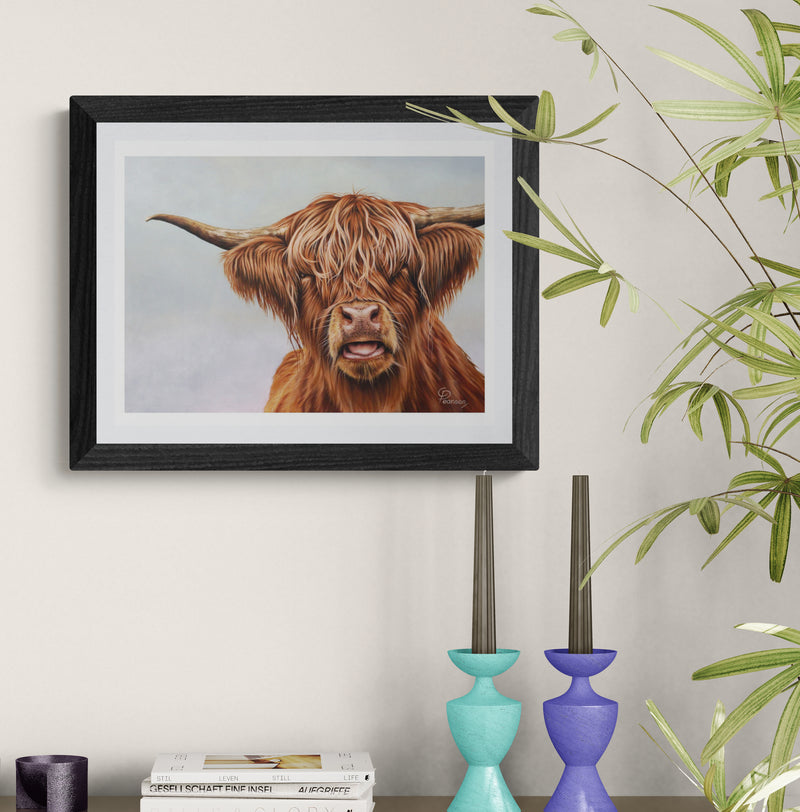 Framed artwork of a highland cow on a wall with decorative vases and plants.