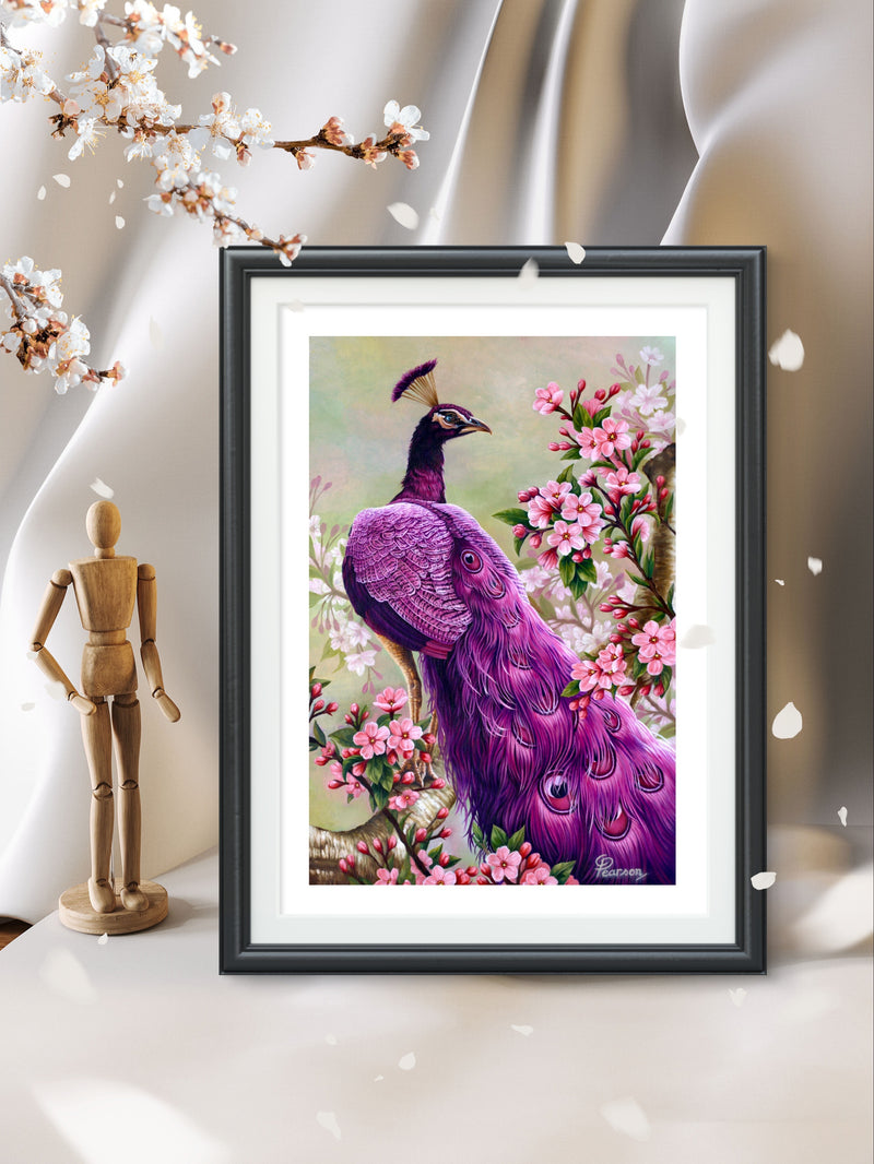 Framed artwork of a purple peacock among flowers on a white surface with a wooden mannequin and cherry blossoms.