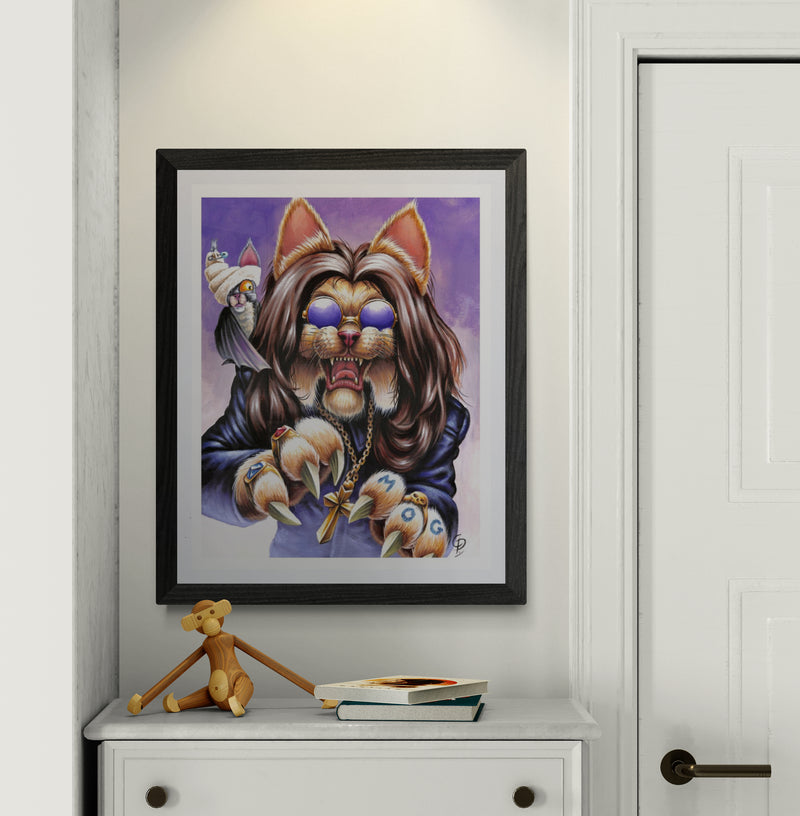 Framed artwork of a stylized cat with a purple background on a white wall.