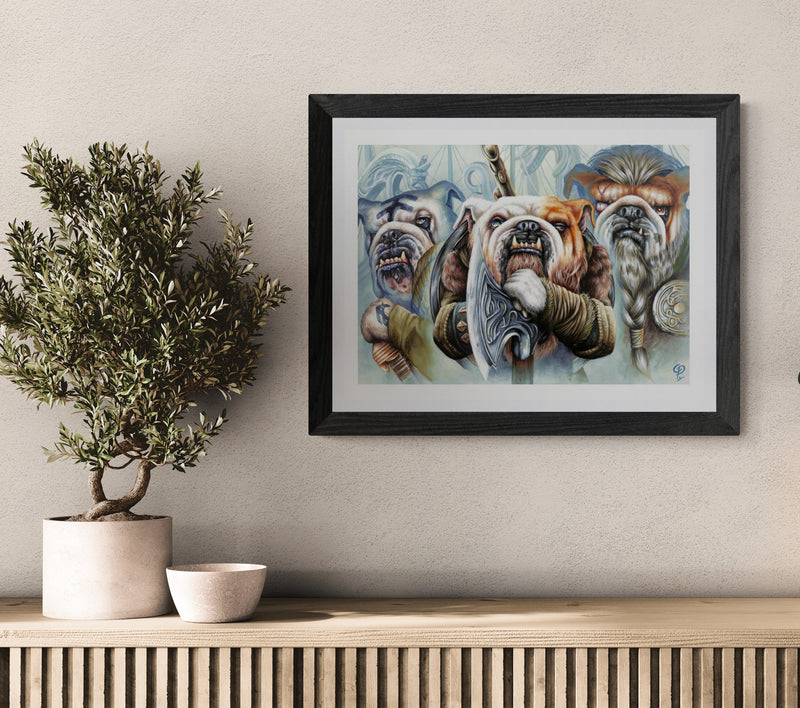Framed artwork of bulldogs on a wall with decorative candles and books