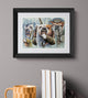 Framed artwork of viking bulldogs with armor on a gray wall above books and a mug.