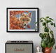 Framed picture of a fox among autumn leaves above a Marshall speaker on a wall.