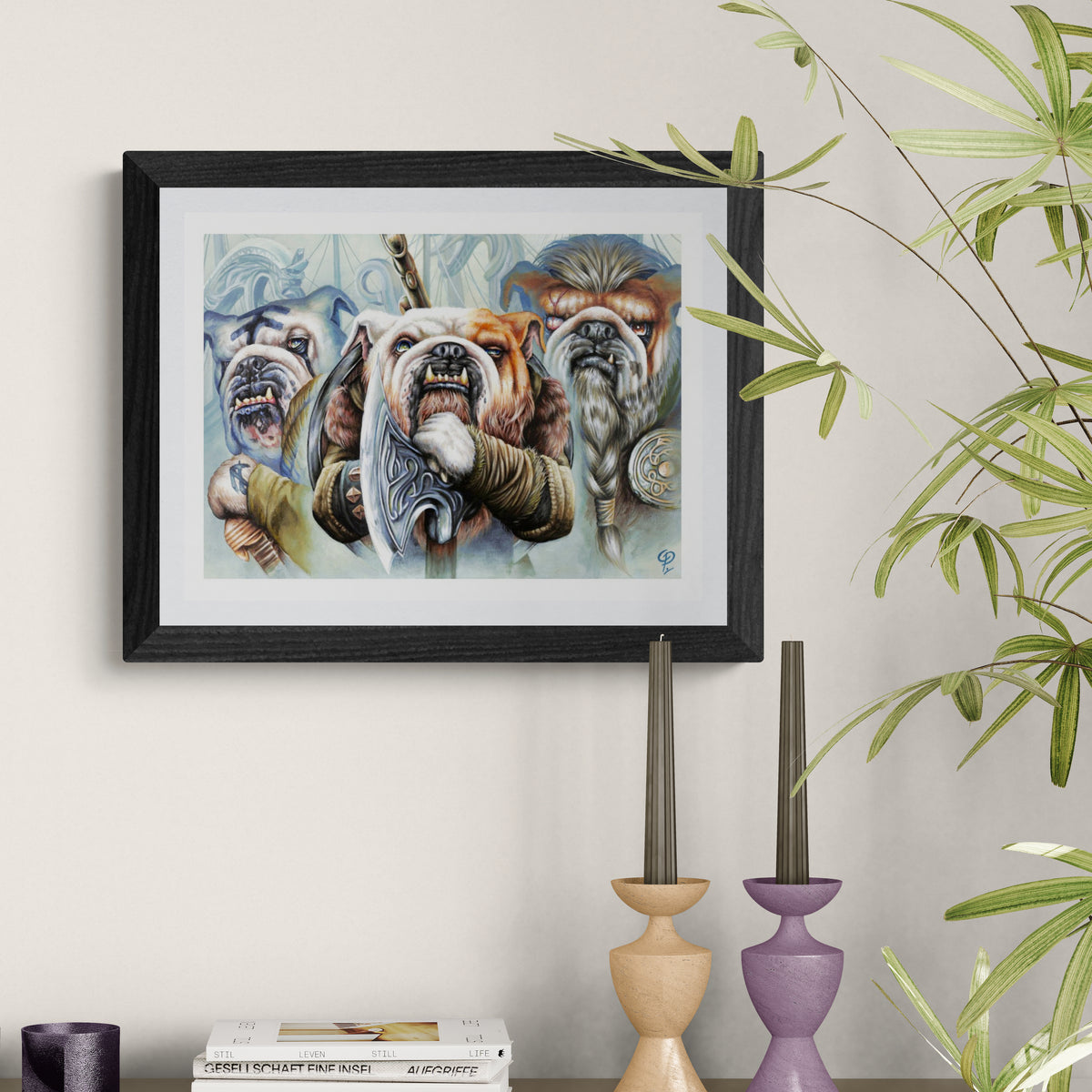 Framed artwork of bulldogs on a wall with decorative candles and books below.
