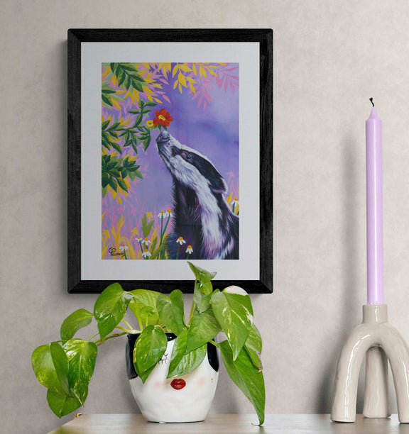 badger sniffing flower